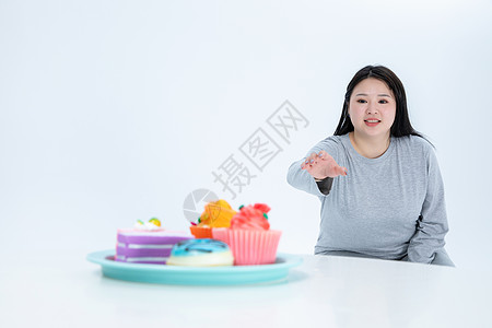 胖女生与甜食图片素材
