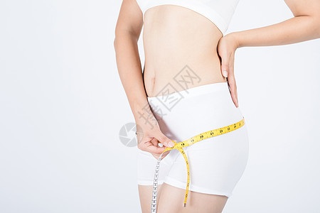 美女测量腰围减肥瘦身背景