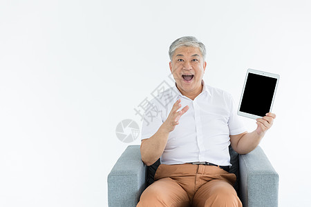 老年人和平板电脑背景图片