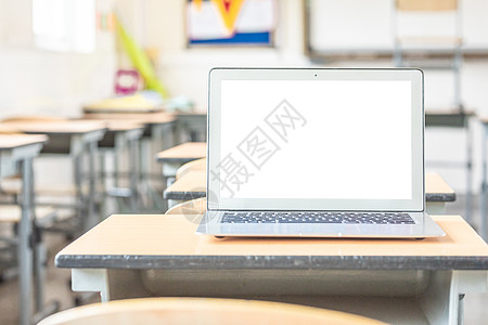 开学背景课桌上的笔记本电脑背景