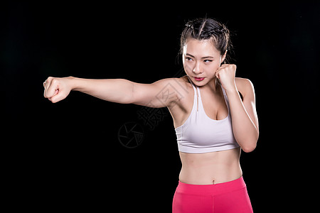 运动健身女性出拳背景图片