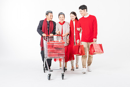 新春年轻夫妻陪伴父母购物背景图片