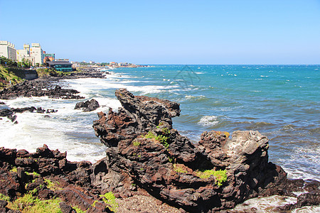 济州岛海浪韩国济州岛龙头岩景区背景