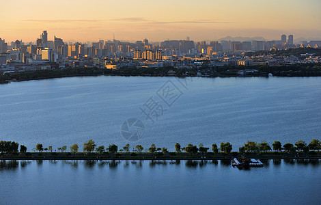 西湖日出杭州西湖苏堤背景