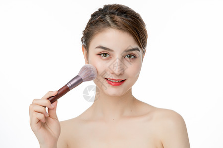 女性化妆涂腮红背景图片