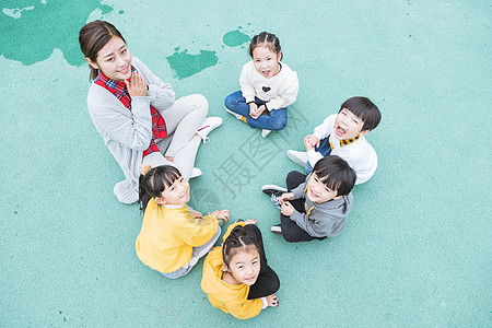 六一儿童幼儿园户外幼师陪伴儿童背景