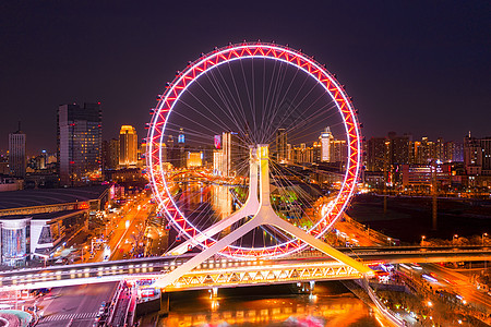 天津海河夜景天津之眼摩天轮背景