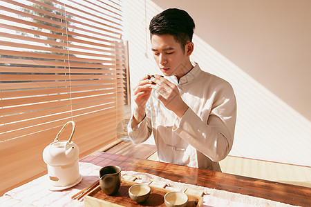 古风帅哥男茶艺师喝茶背景