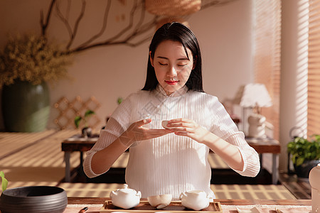 女性茶艺师美女品茶背景