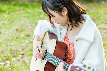 文艺女生弹吉他背景图片