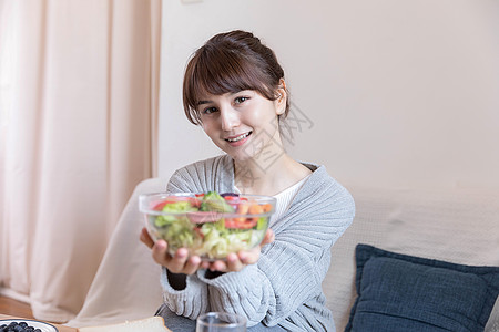 居家女性吃早餐背景图片