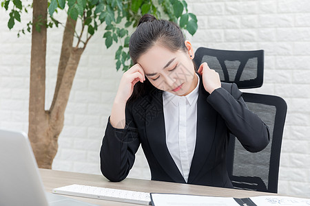 商务女性肩颈酸痛职场高清图片素材