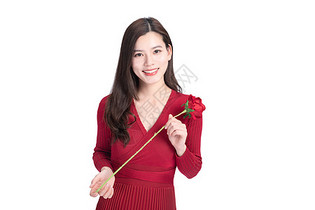 女性手持玫瑰花图片