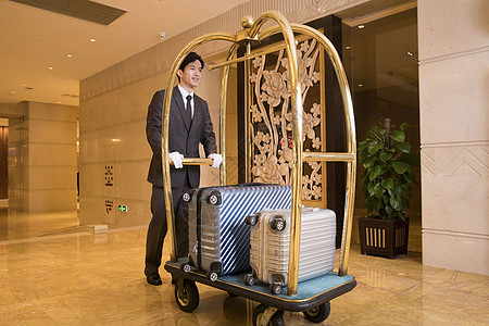 数字化运酒店服务员搬运行李背景