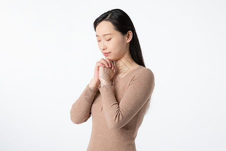 女性祈祷许愿背景图片