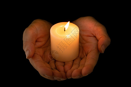 手捧蜡烛祈福图片素材