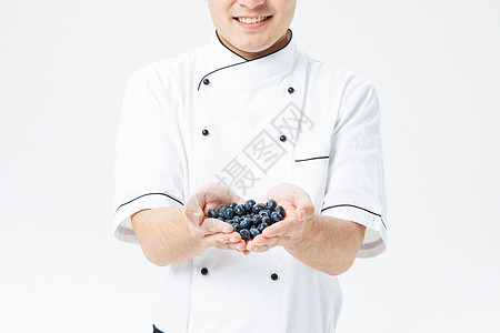 厨师拿着蓝莓图片