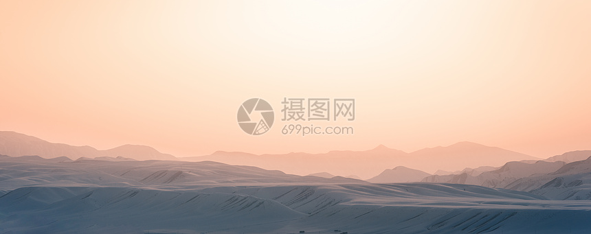 冬季山峦日落朦胧色彩素材背景设计图片
