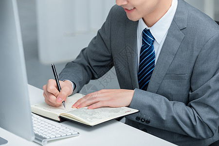 商务男士做笔记商务男士办公背景