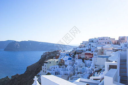 地中海旅游希腊圣托里尼悬崖上的白色房子背景