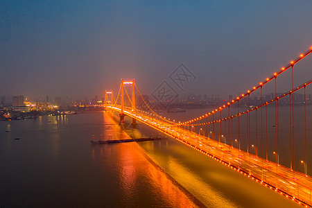 夜晚璀璨灯光下的城市桥梁城市街景高清图片素材