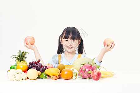 小女孩与水果图片