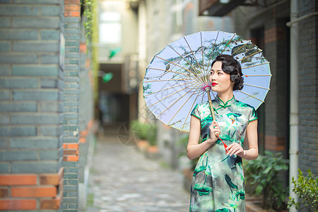 旗袍女人旗袍女性打伞背景