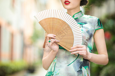 旗袍女性折扇背景图片