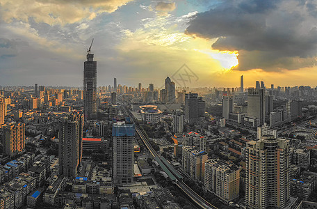 城市街景夕阳晚霞下的城市日落风光背景