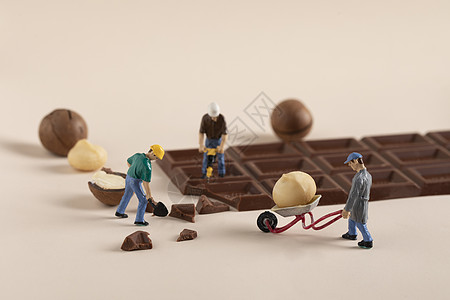 坚果巧克力创意微距劳动小人背景