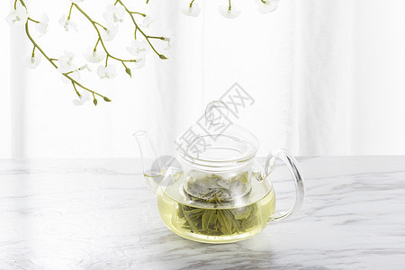 绿茶与玻璃茶壶背景图片
