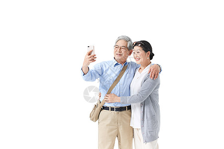 老年夫妇拍照背景图片
