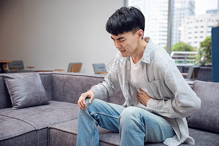 男青年人物男青年肚子疼背景