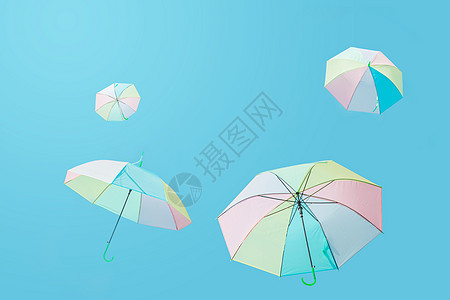 卡通彩色雨伞飞上蓝天的彩色伞背景