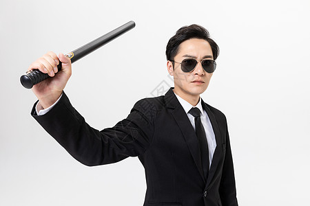 保镖拿着甩棍图片素材