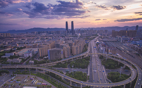 航拍高架昆明城市航拍夜景夕阳晚霞背景