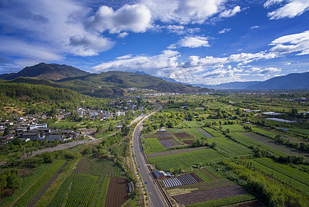 乡村城市大气丽江雪山城市田野航拍背景