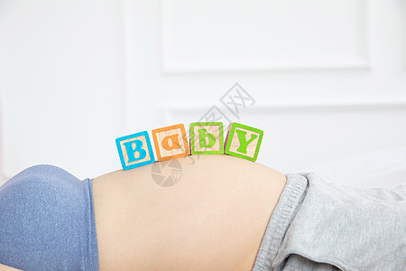 孕妇照孕妇肚子字母背景