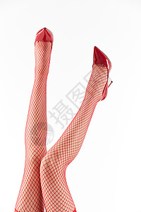 女性穿着红色丝袜和红色高跟鞋俯拍特写背景图片