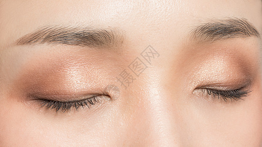 女性双眼眼妆展示背景图片