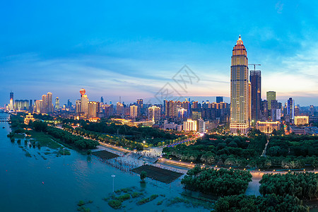 江景夜景夕阳晚霞下的城市地标建筑夜景背景