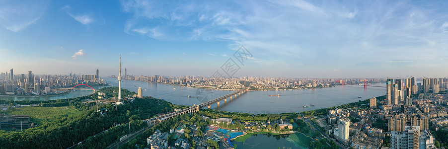 蓝天白云下城市江景大桥全景长图图片