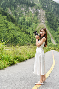 女生拍摄风景美女旅行相机拍照背景