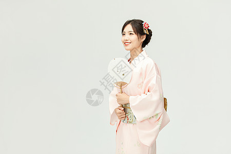 日本传统和服美女拿着扇子背景
