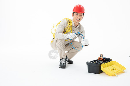 维修工人拿着电线工具箱图片