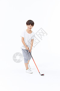 小男孩打高尔夫球图片