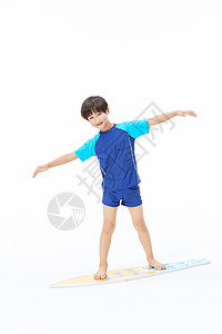 小男孩玩冲浪板图片