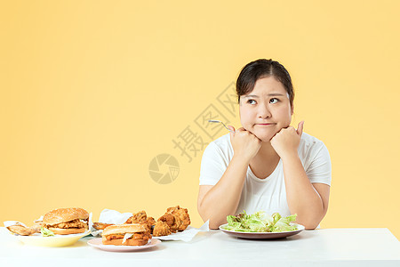 减肥痛苦胖女孩吃色拉减肥背景