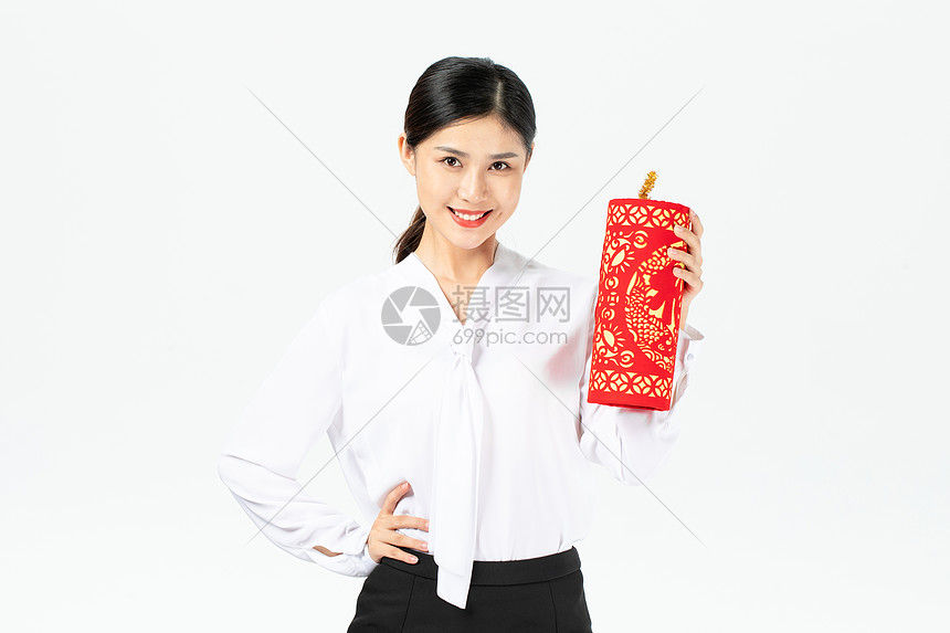 商务美女拿新年挂件迎新年图片