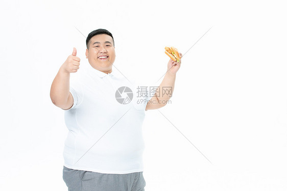 青年男性胖子吃汉堡图片